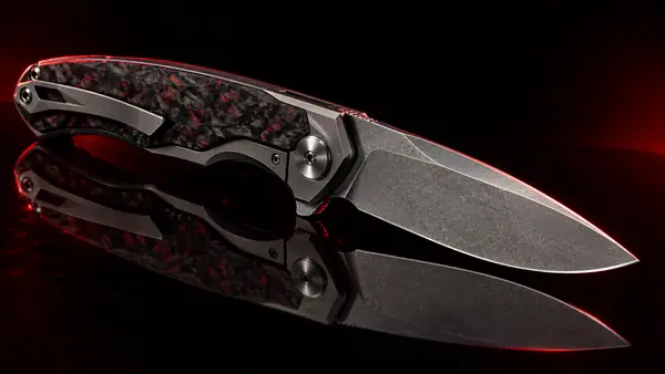 Illustrative studio render of a titanium frame-lock flipper with carbon fibre scale, not the actual model